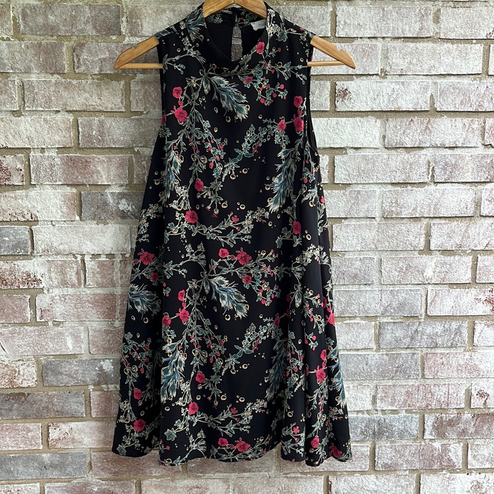 Peach Love sleeveless black floral swing dress with keyhole back. Size small.